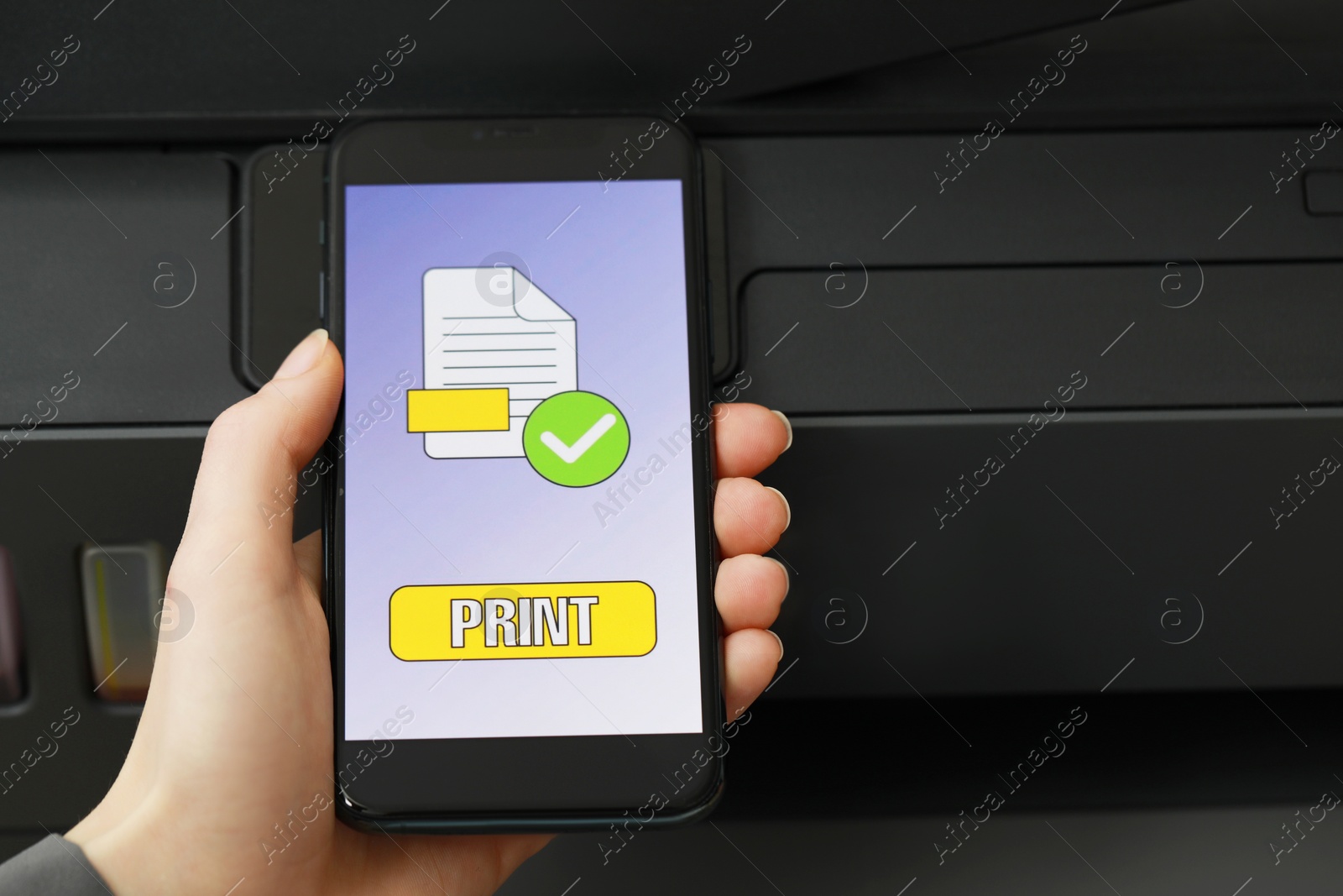 Photo of Woman using printer management application on smartphone, closeup and space for text. Image on device screen.