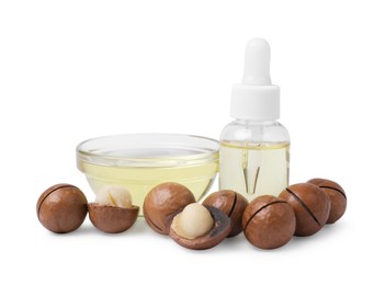 Photo of Delicious organic Macadamia nuts and natural oil isolated on white