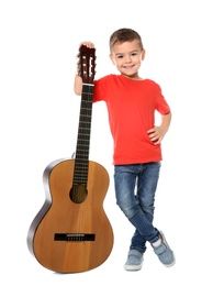 Little boy with acoustic guitar on white background