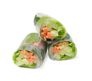 Photo of Different delicious spring rolls wrapped in rice paper on white background