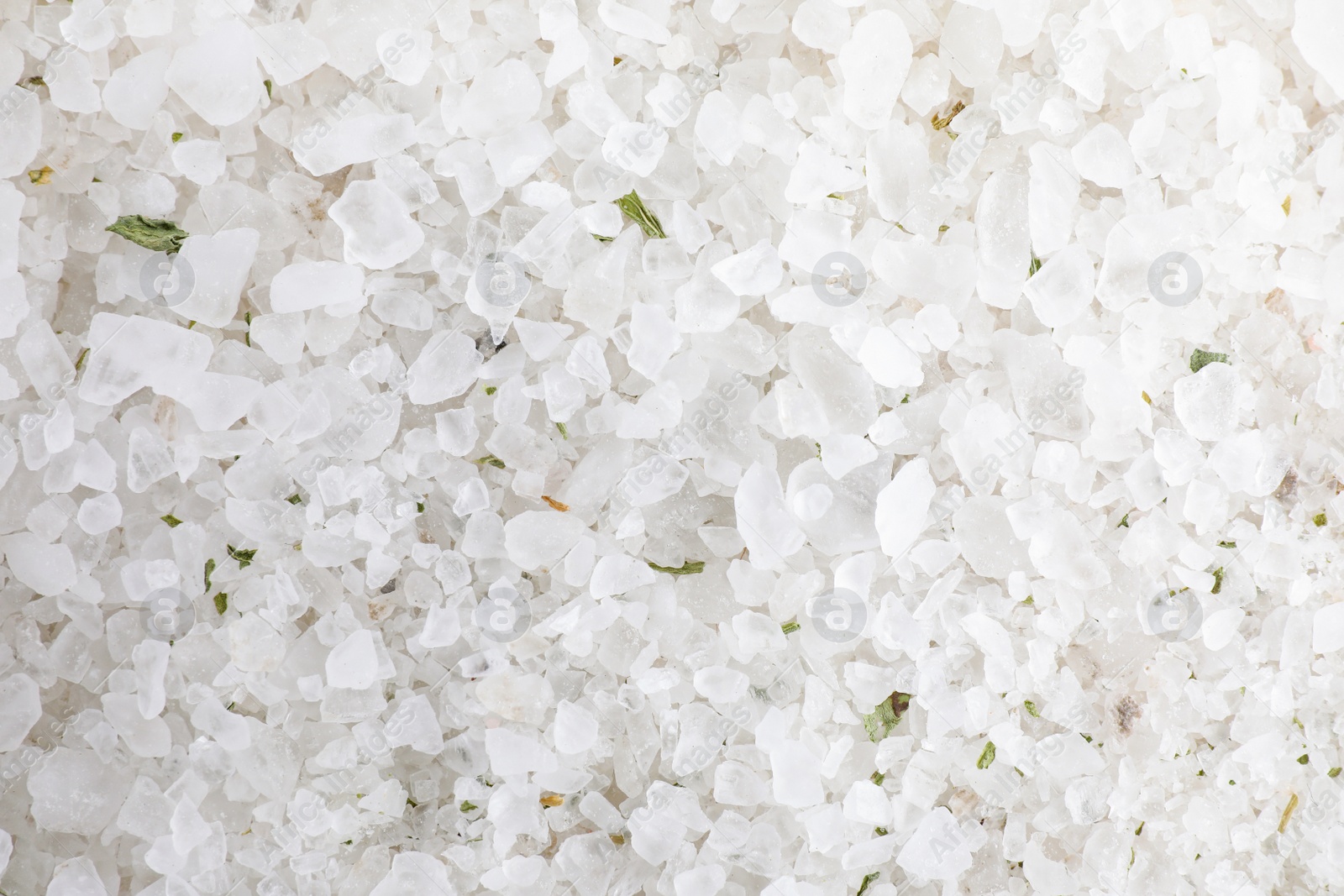 Photo of White sea salt as background, top view. Spa treatment