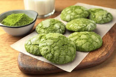 Tasty matcha cookies on wooden table, closeup