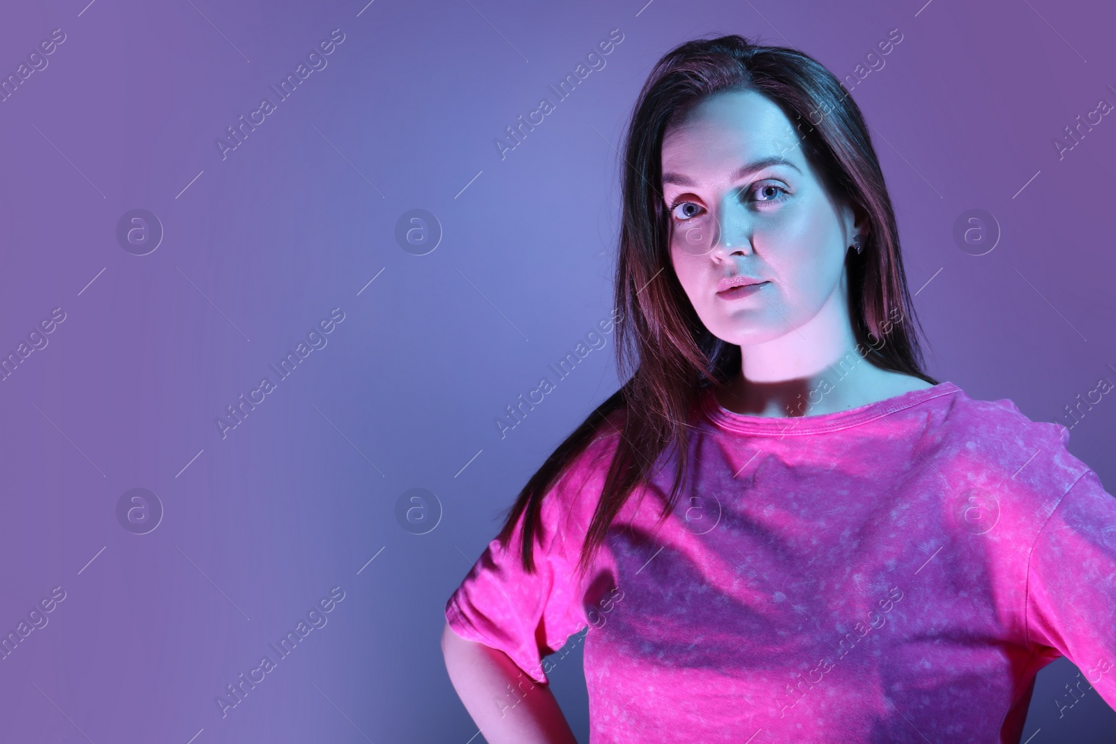 Photo of Portrait of beautiful woman on color background, space for text