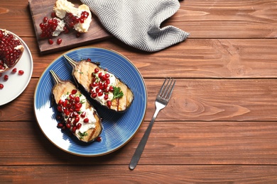 Photo of Flat lay composition with plate of fried eggplants and space for text on wooden table