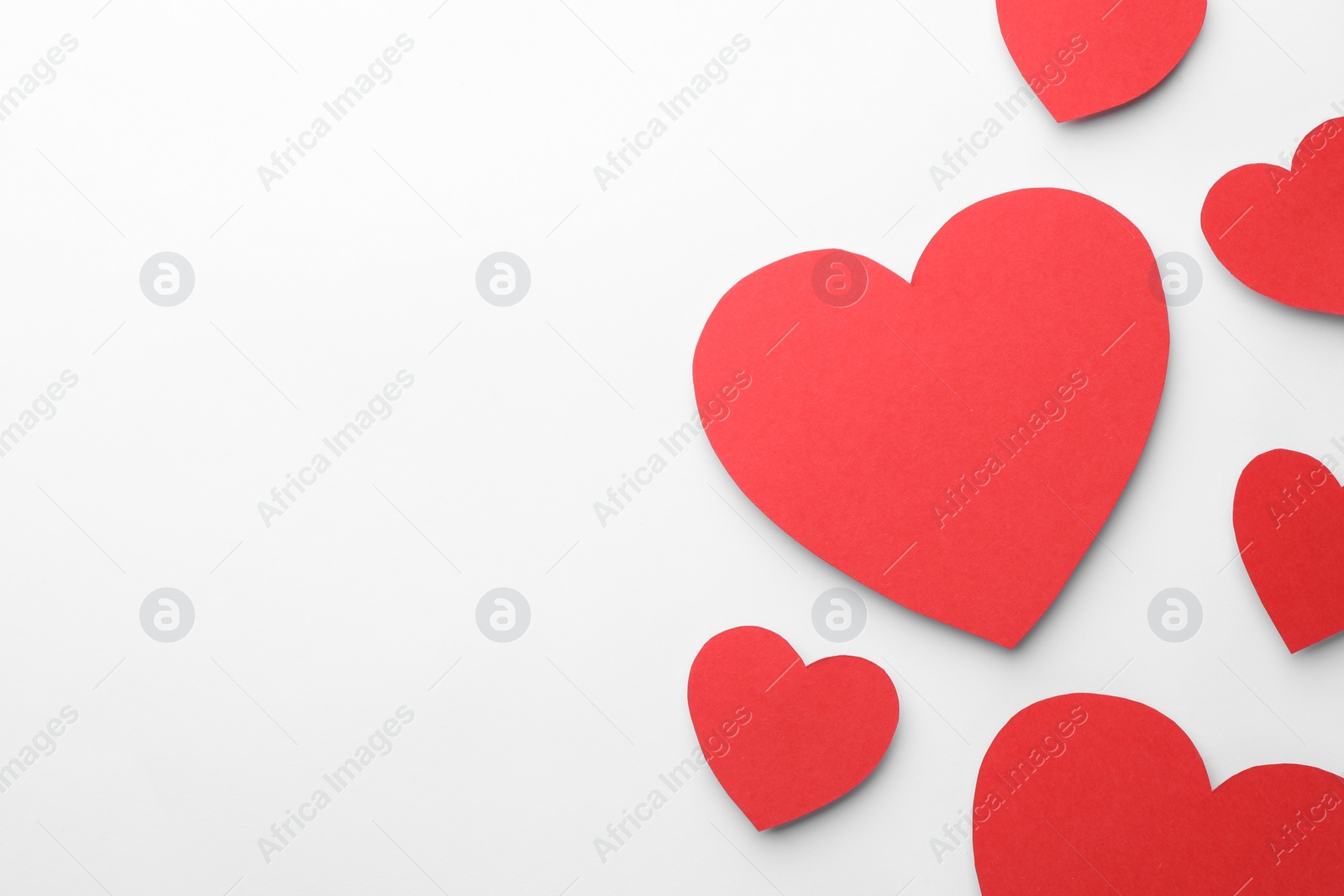 Photo of Paper hearts on white background, flat lay. Space for text