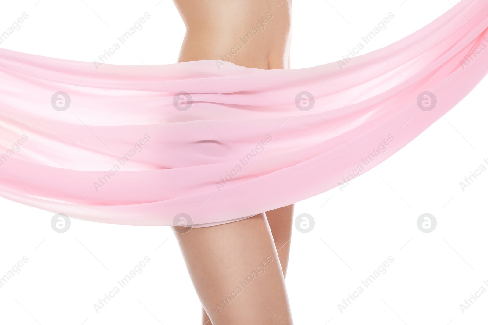 Photo of Slim young woman covered with silk fabric on white background, closeup. Fit body