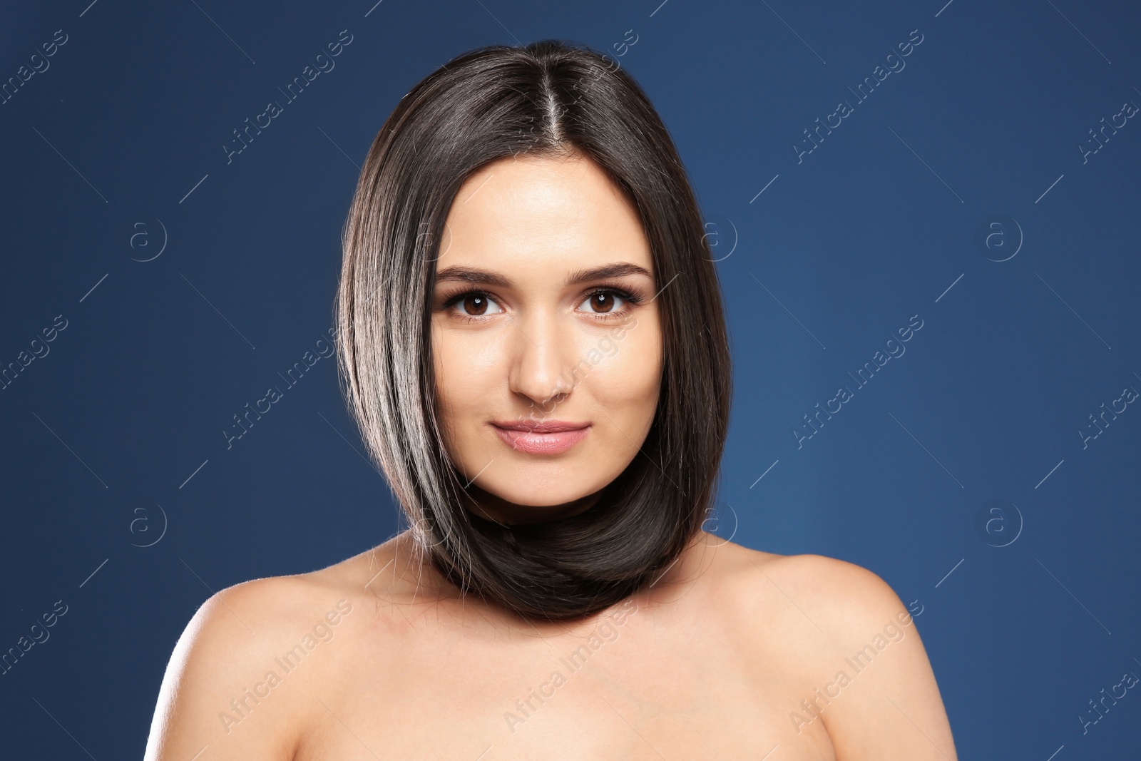 Photo of Portrait of beautiful model with gorgeous straight hair on color background