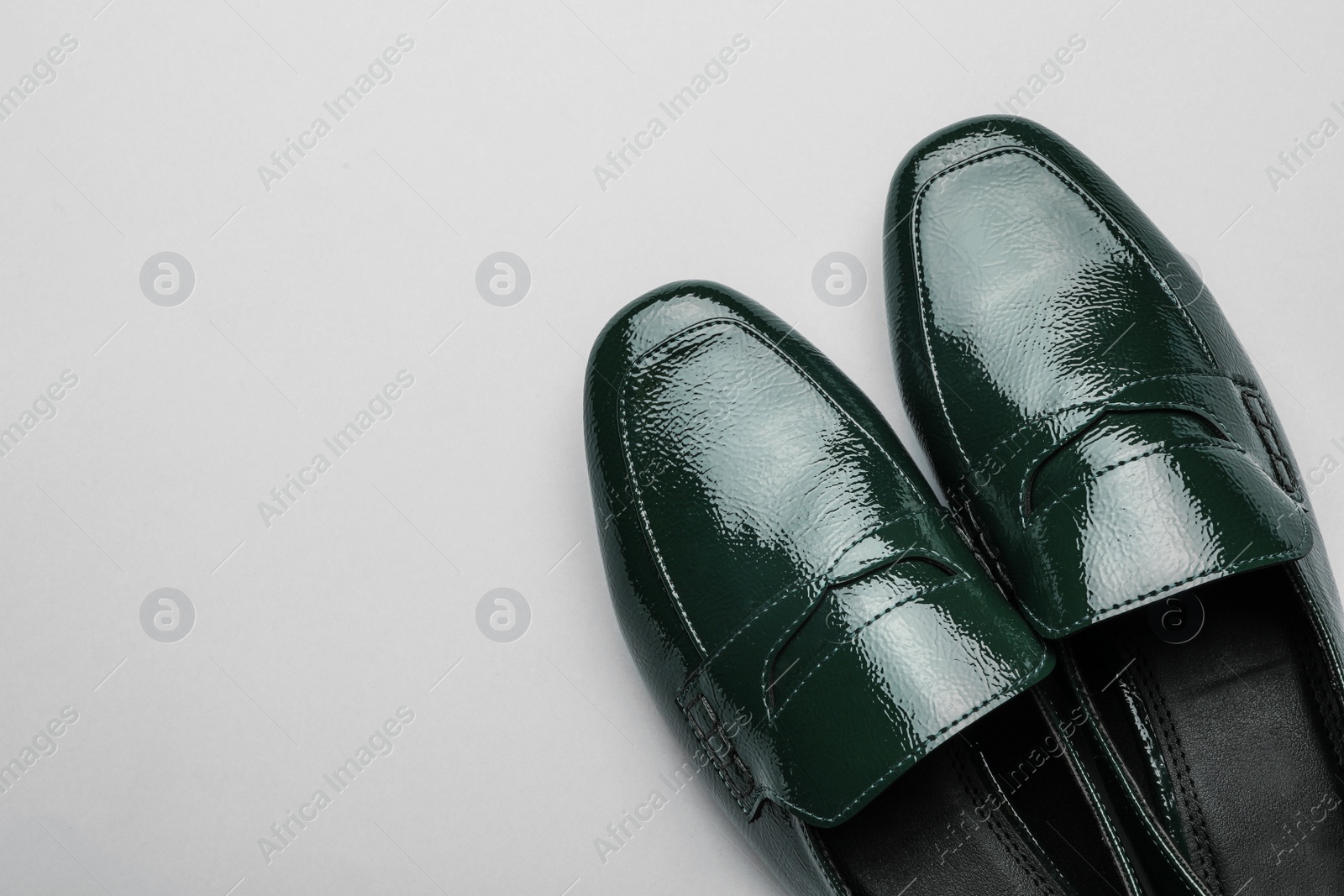 Photo of Pair of stylish female shoes on light grey background, top view