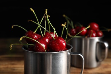 Wet red cherries in enameled mug, closeup