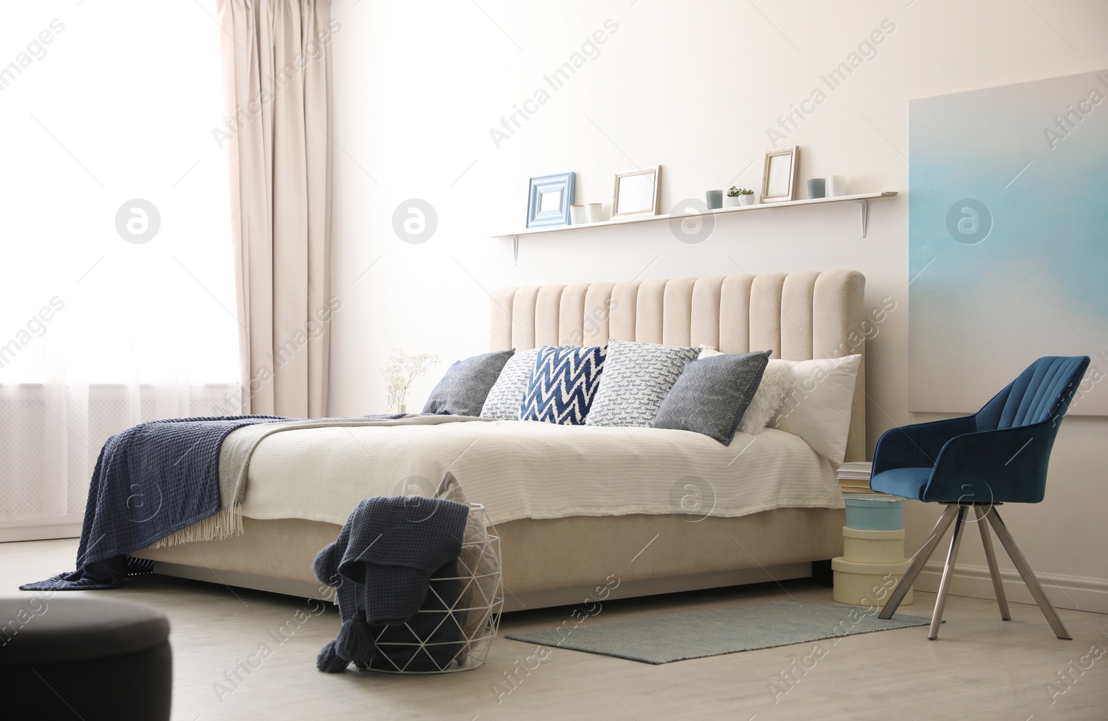 Photo of Comfortable bed with pillows in room. Stylish interior design