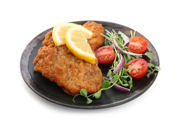 Plate of delicious schnitzels with lemon, tomatoes, onion and microgreens isolated on white