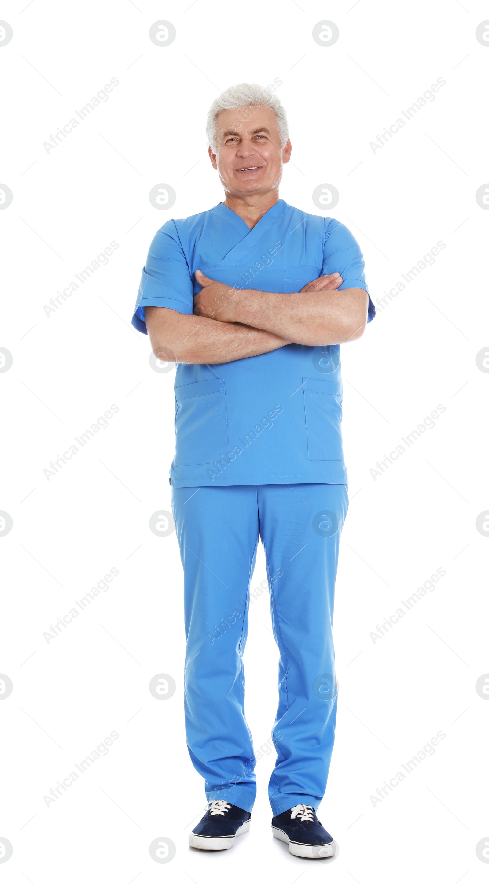 Photo of Full length portrait of male doctor in scrubs isolated on white. Medical staff