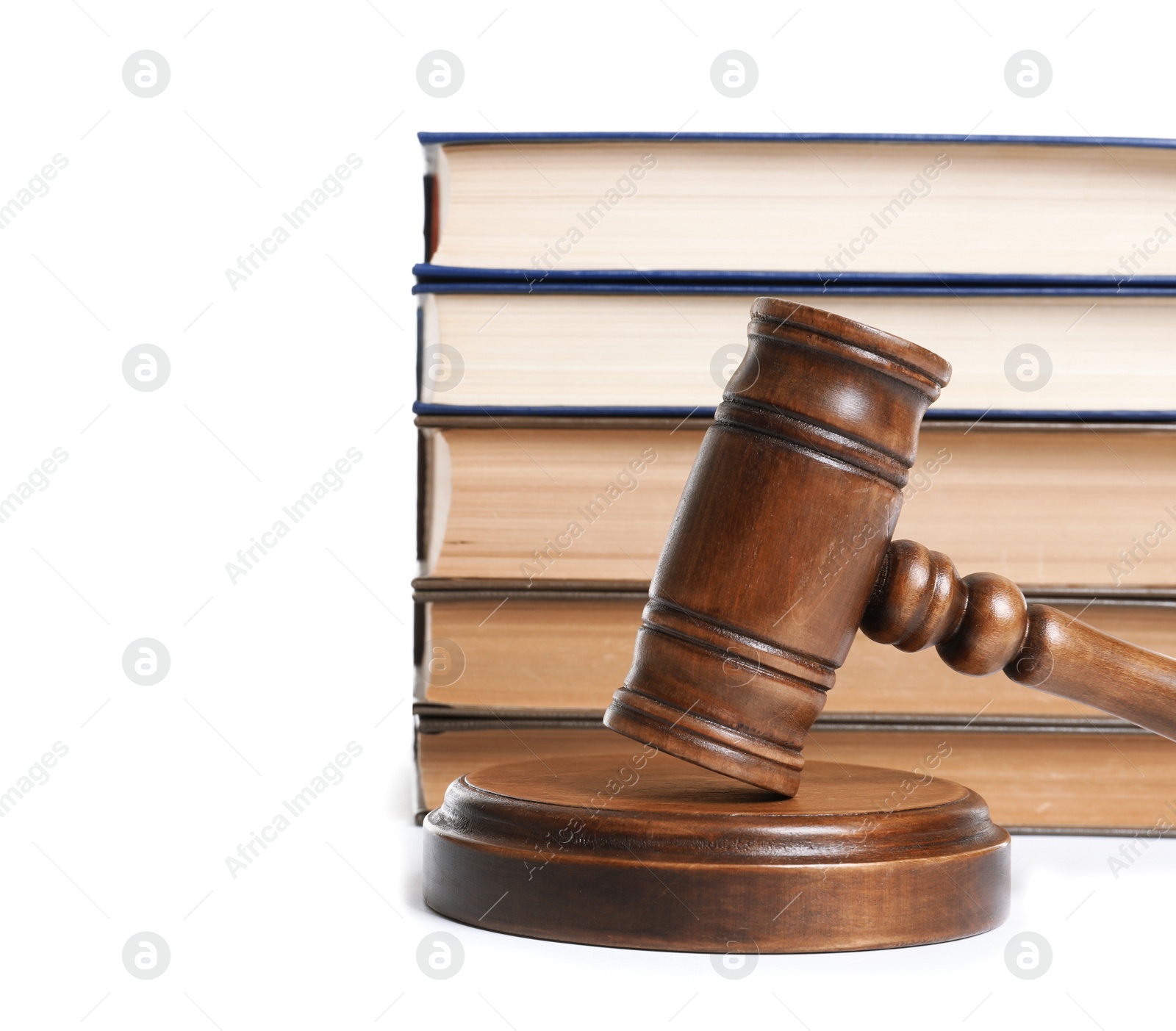 Photo of Wooden gavel and books on white background. Law concept