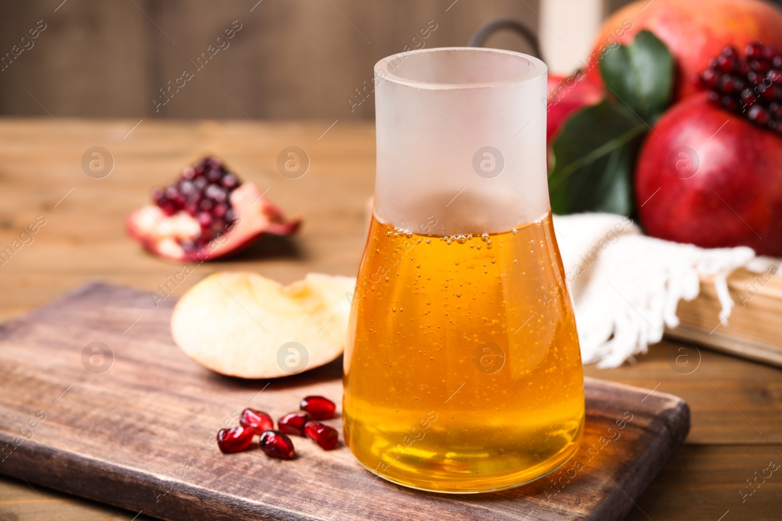 Photo of Jar with honey on wooden table. Rosh Hashanah holiday