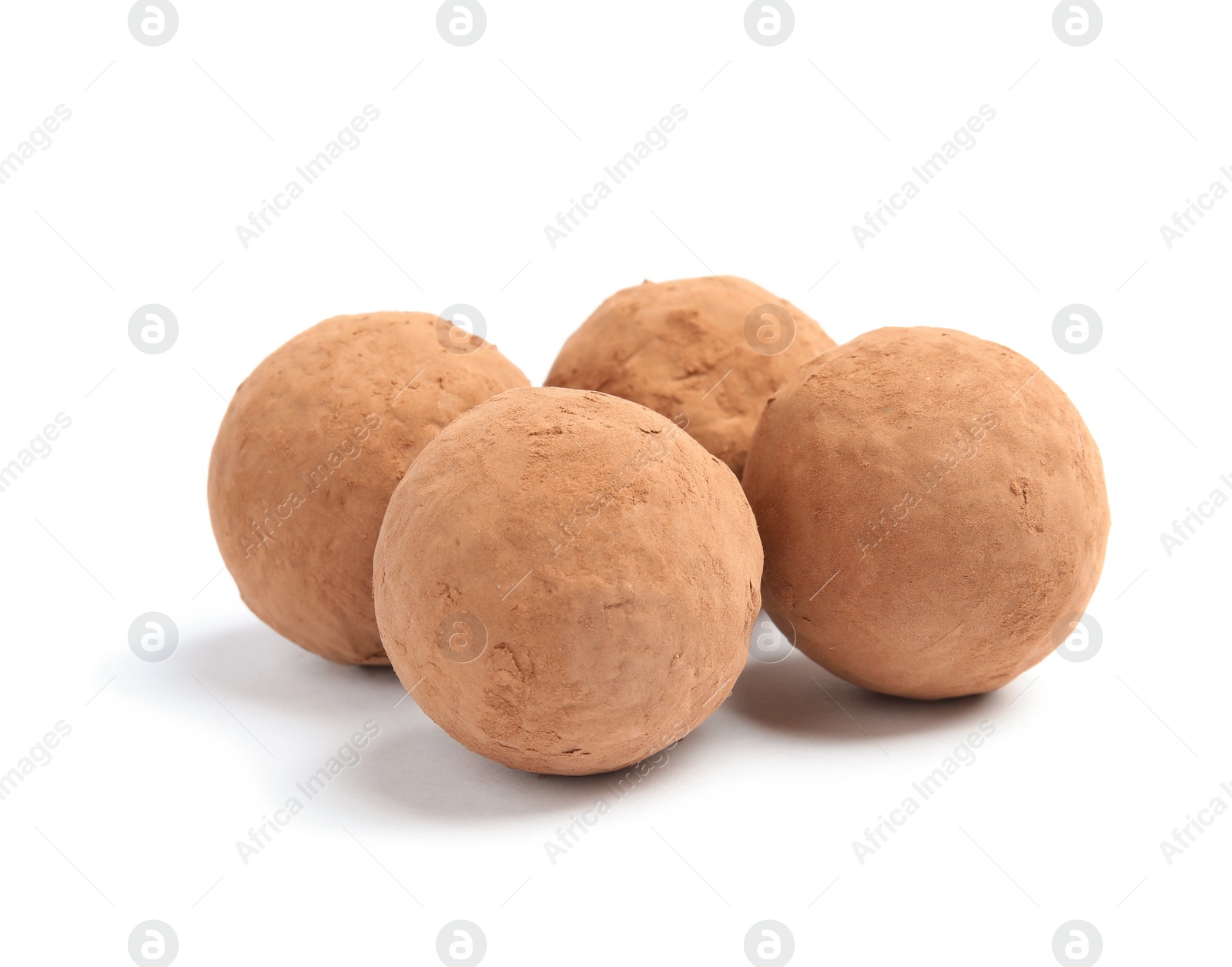 Photo of Delicious raw chocolate truffles on white background