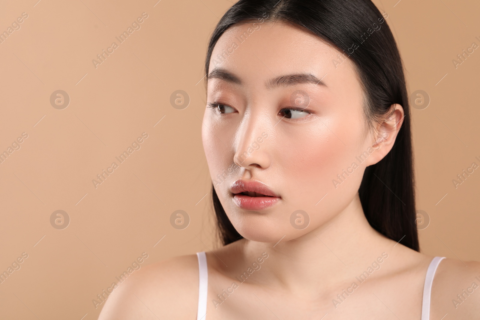 Photo of Beautiful woman with healthy skin on beige background, space for text