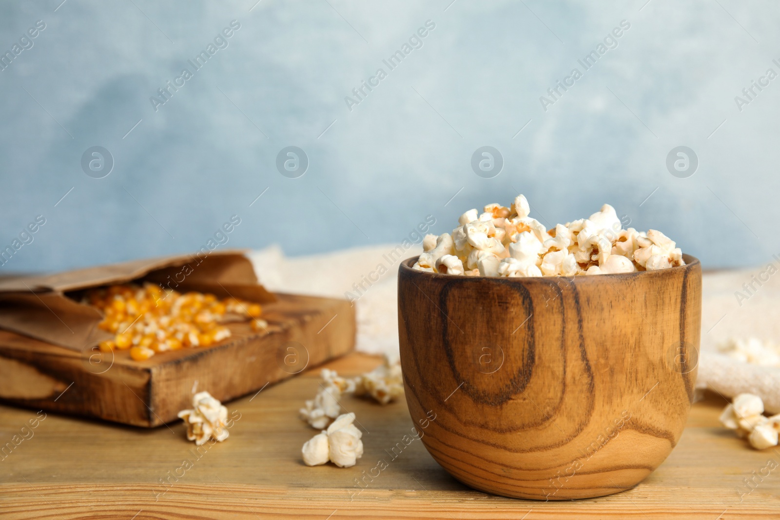 Photo of Tasty fresh pop corn on wooden table