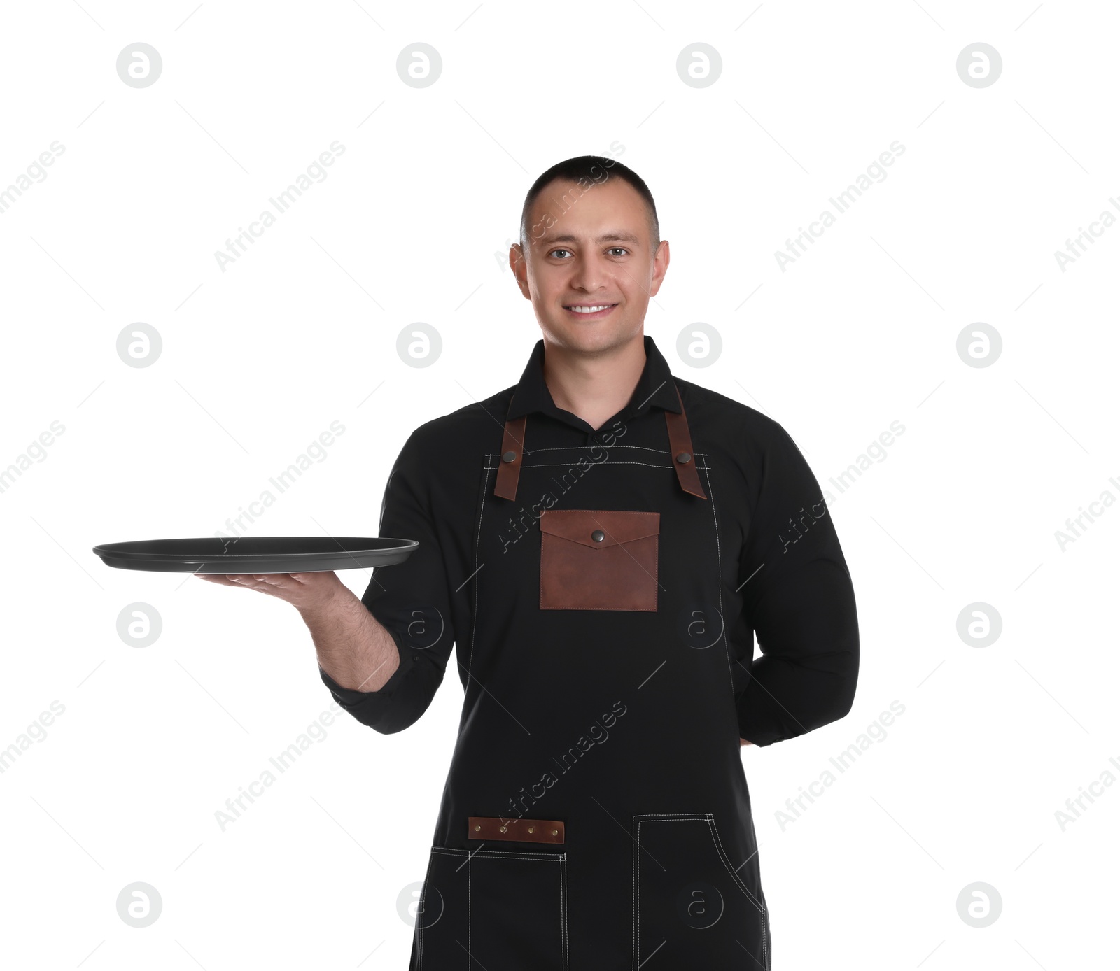 Photo of Portrait of happy young waiter with tray on white background