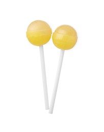 Photo of Two sweet yellow lollipops isolated on white, top view