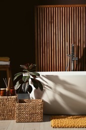 Photo of Cozy bathroom interior with stylish ceramic tub