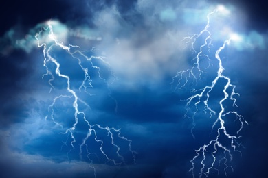 Image of Lightnings in dark cloudy sky during thunderstorm