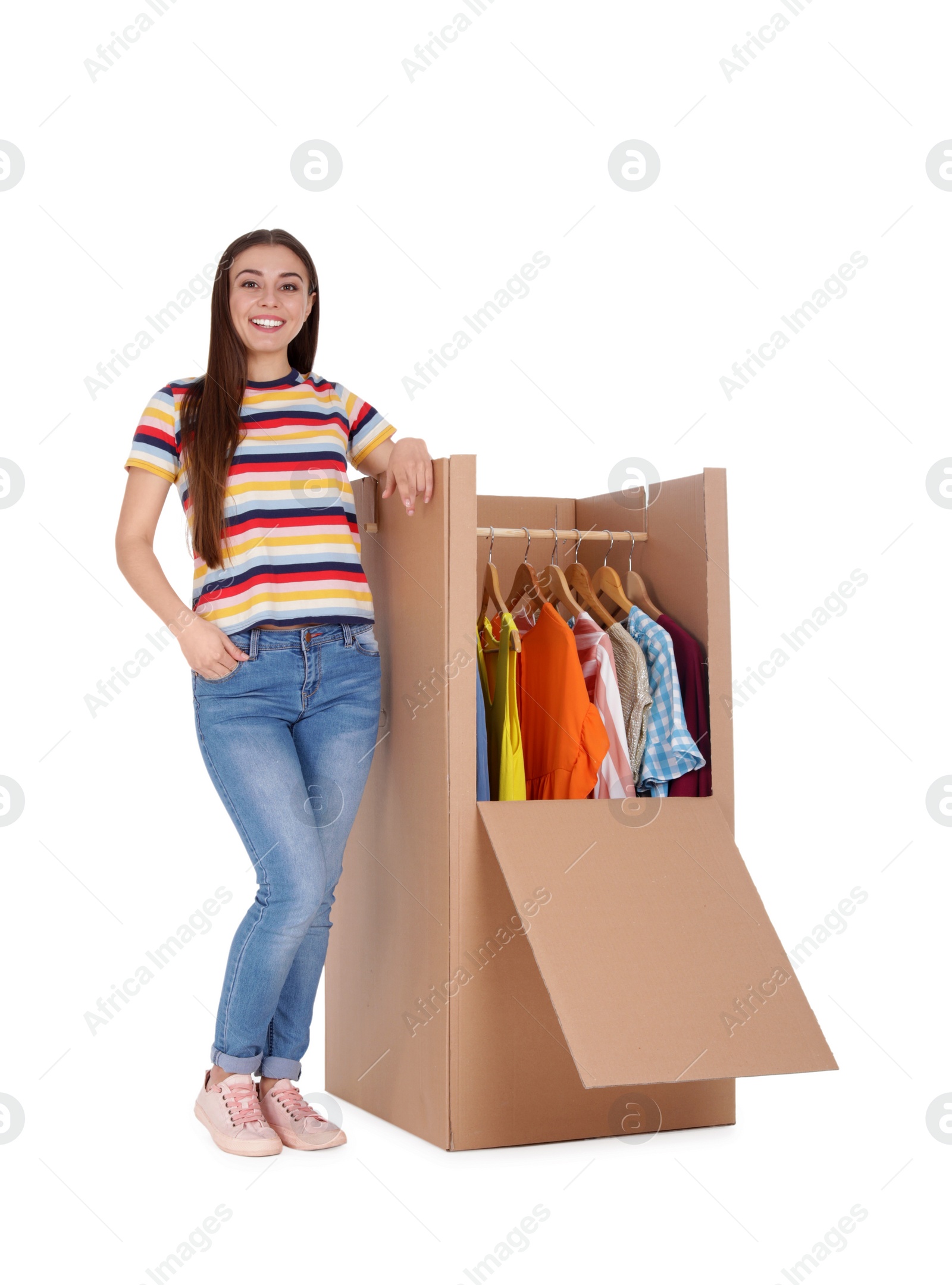 Photo of Young woman near wardrobe box on white background