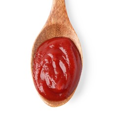 Photo of Ketchup in wooden spoon isolated on white, top view