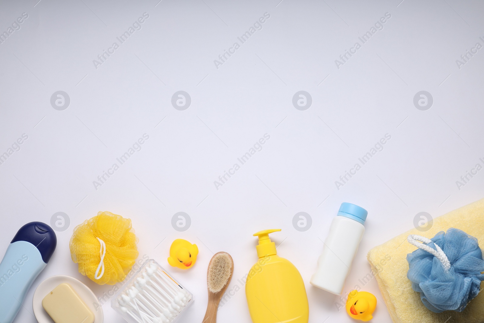 Photo of Different baby bath accessories and cosmetic products on white background, flat lay. Space for text