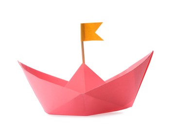 Photo of Handmade pink paper boat with orange flag isolated on white. Origami art