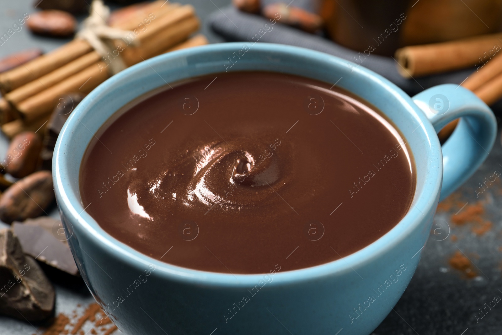 Photo of Yummy hot chocolate in cup on table, closeup