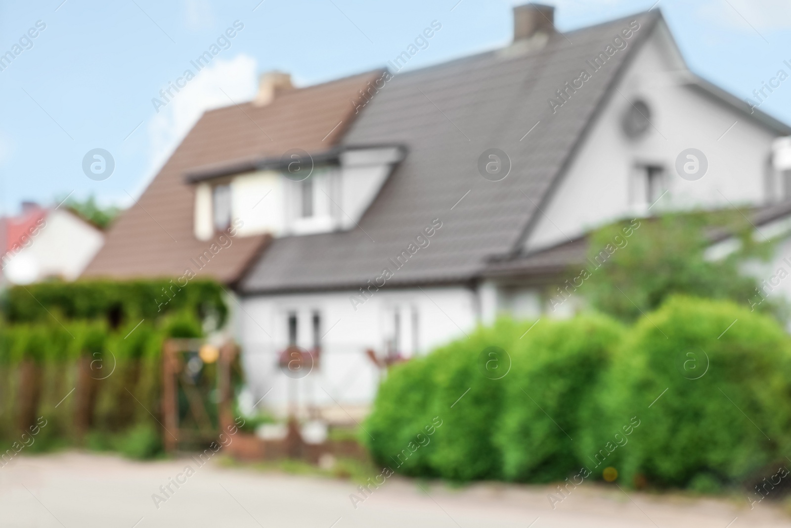 Photo of Blurred view of house with beautiful green garden