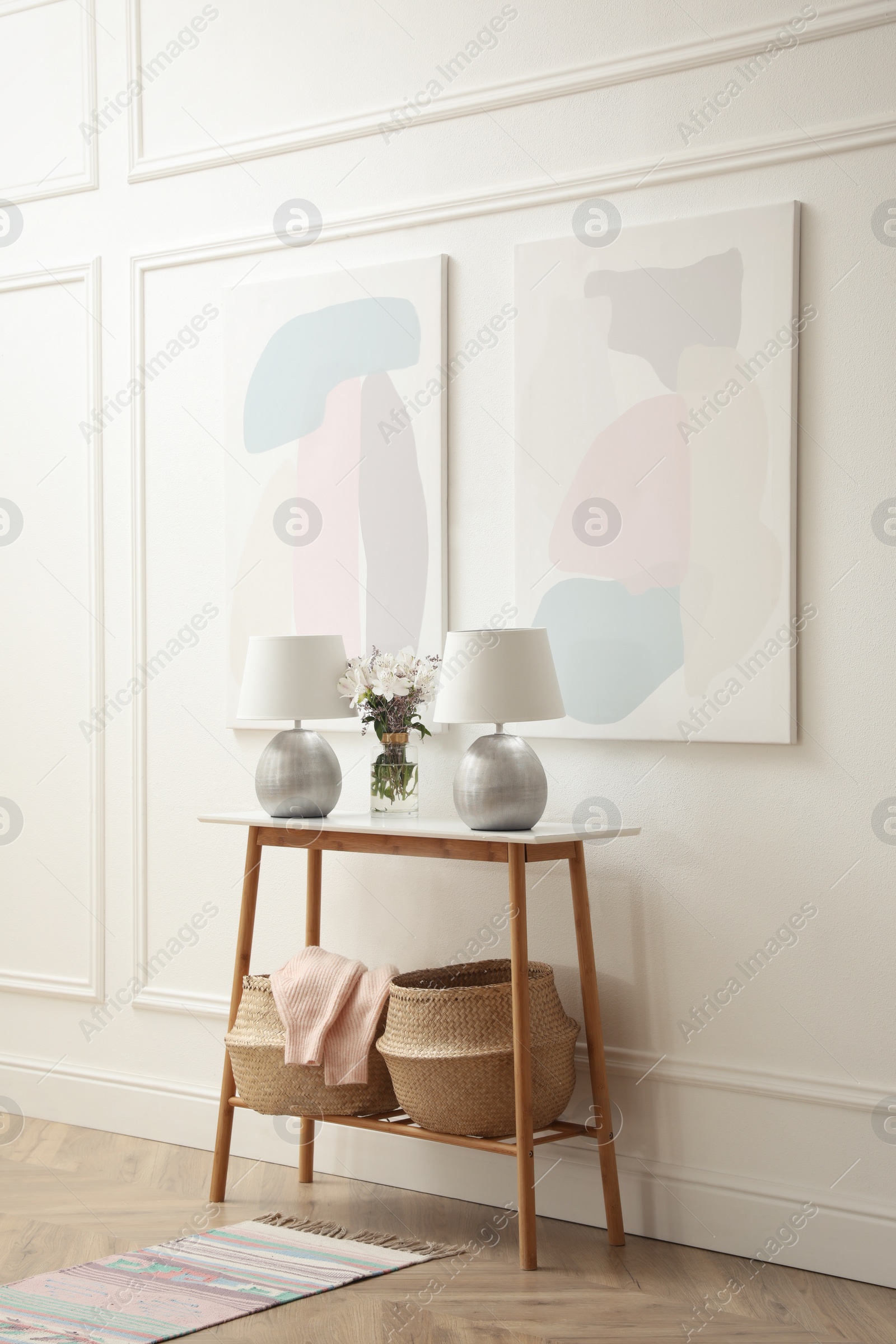 Photo of Elegant room interior with console table and beautiful flowers bouquet