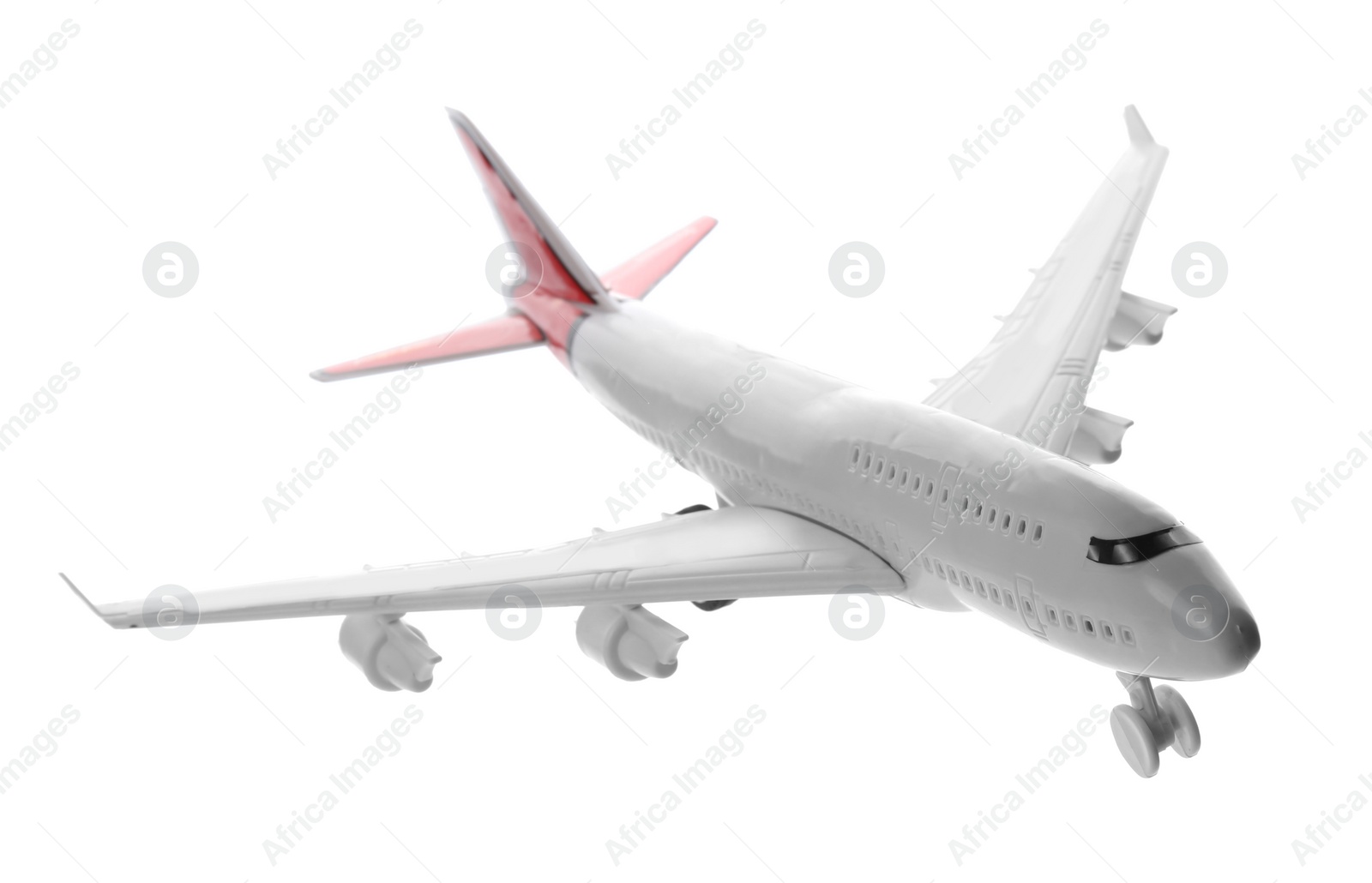 Photo of Toy airplane isolated on white. Travel concept