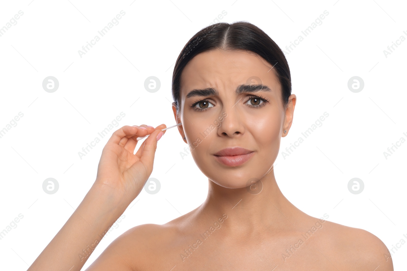 Photo of Young woman cleaning ear with cotton swab on white background