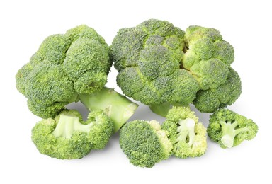 Photo of Pile of fresh raw green broccoli isolated on white