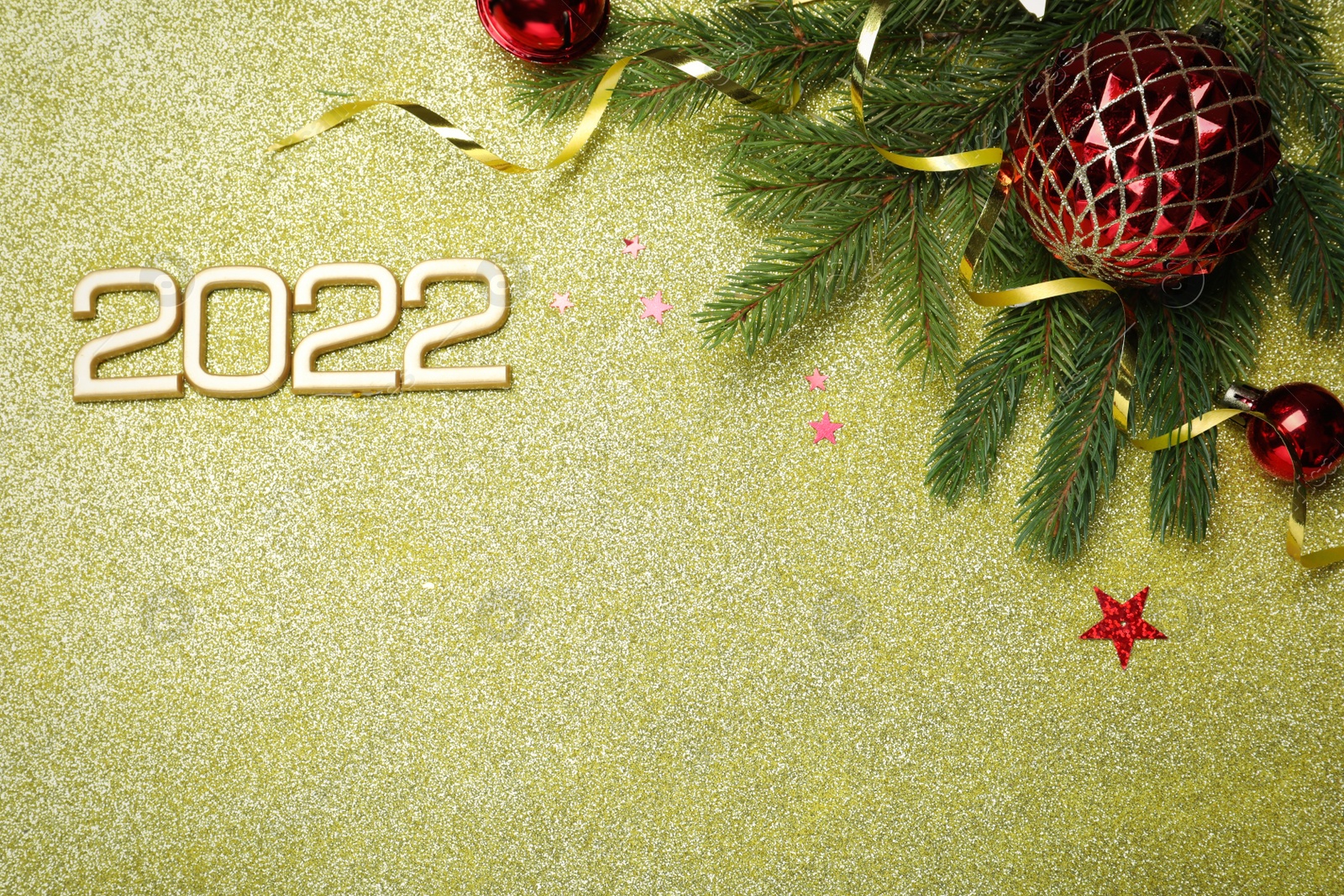 Photo of Flat lay composition with number 2022 and festive decor on shiny background, space for text. Happy New Year