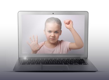 Internet addiction. Little girl trapped in computer. Child knocking on monitor from inside