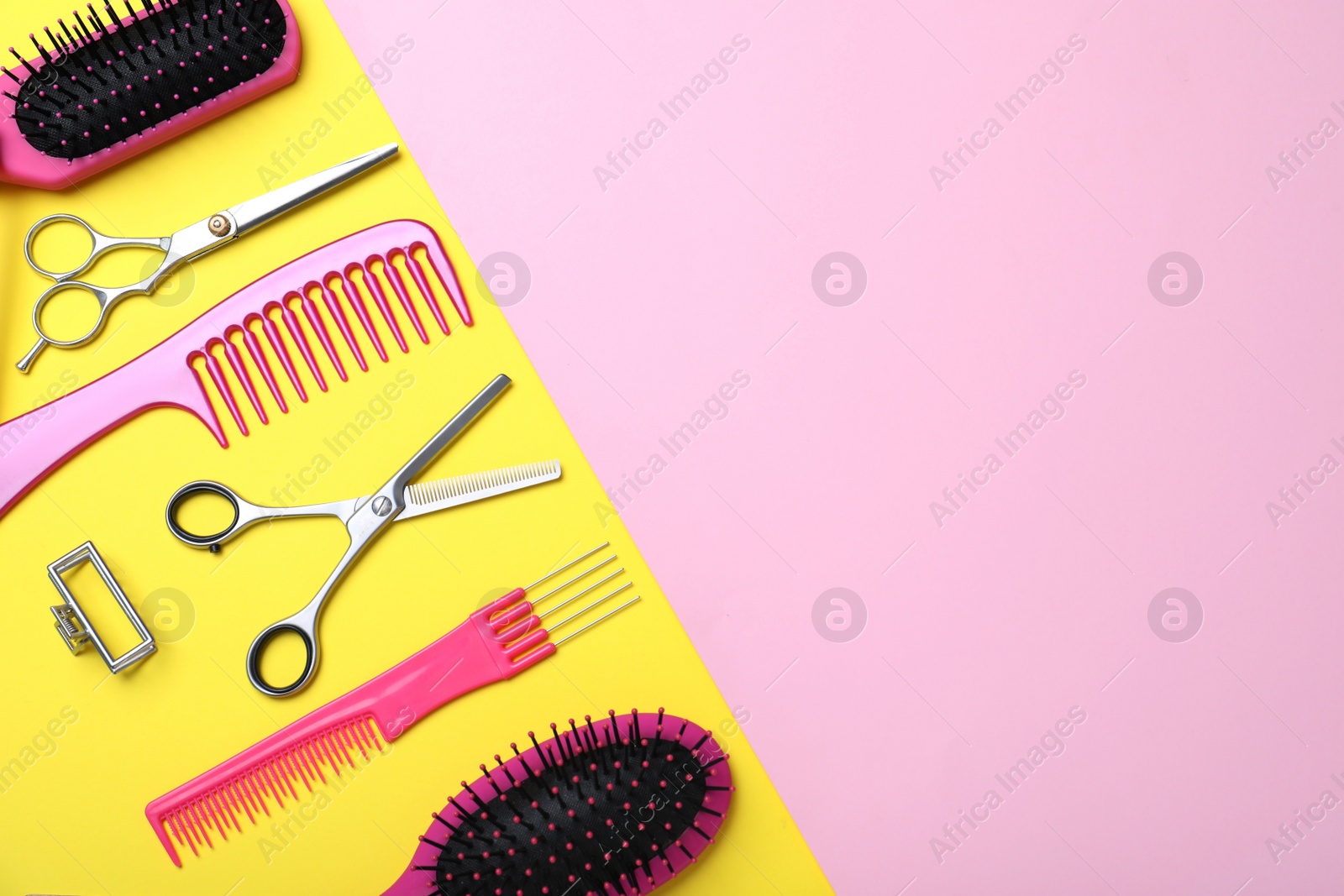 Photo of Flat lay composition with professional scissors and other hairdresser's equipment on color background, space for text. Haircut tool