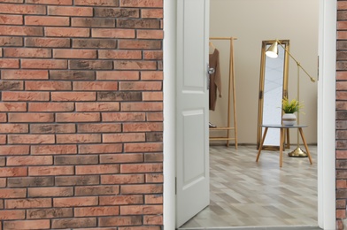 Photo of Stylish room interior, view through open door. Space for text