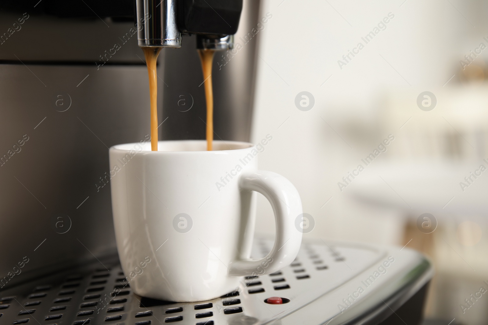 Photo of Espresso machine pouring coffee into cup against blurred background, closeup. Space for text