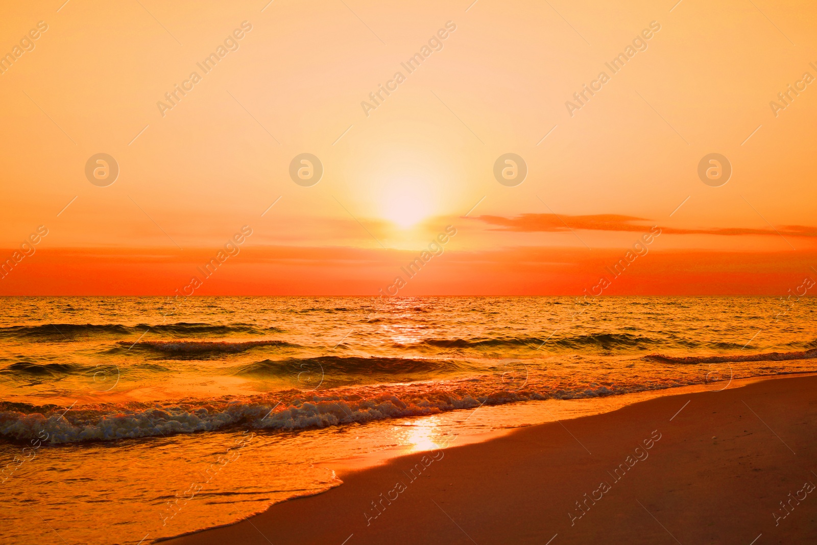 Image of Beautiful view of orange sky over sea at sunset