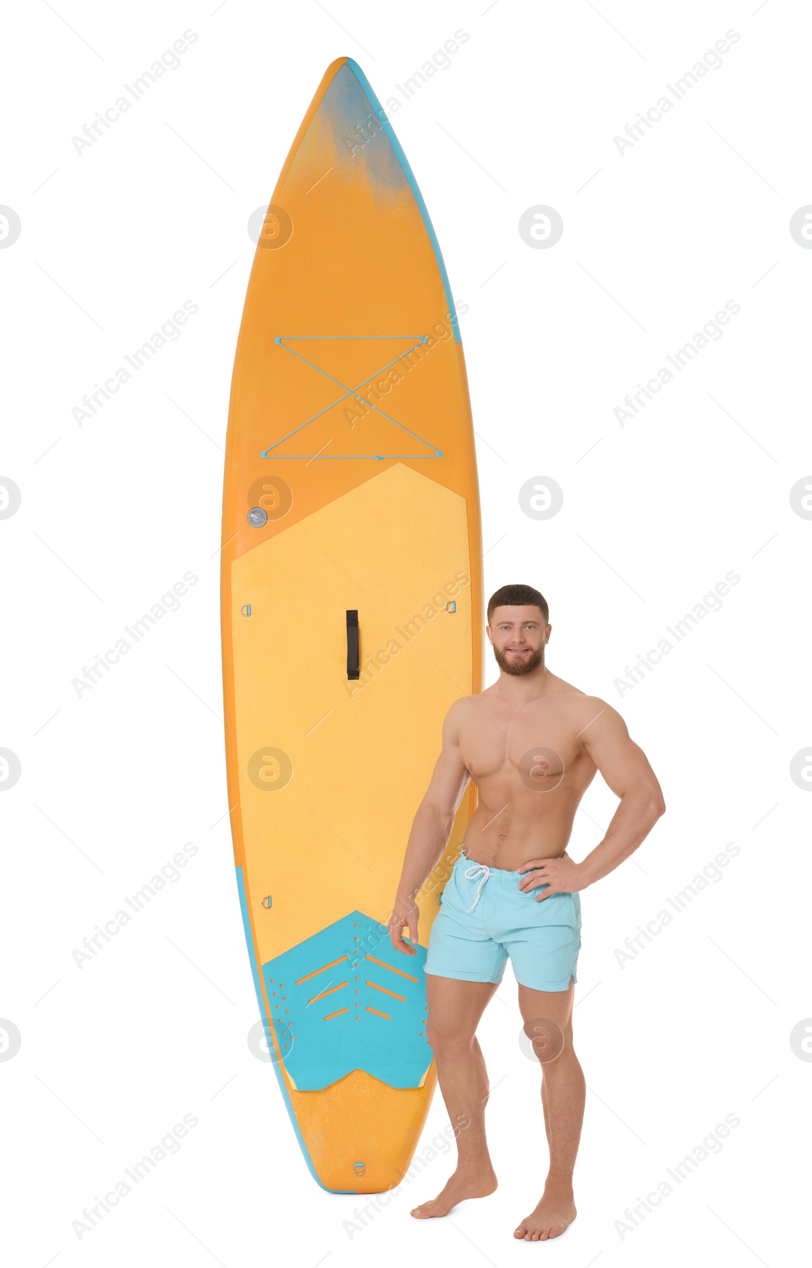 Photo of Handsome man with orange SUP board on white background