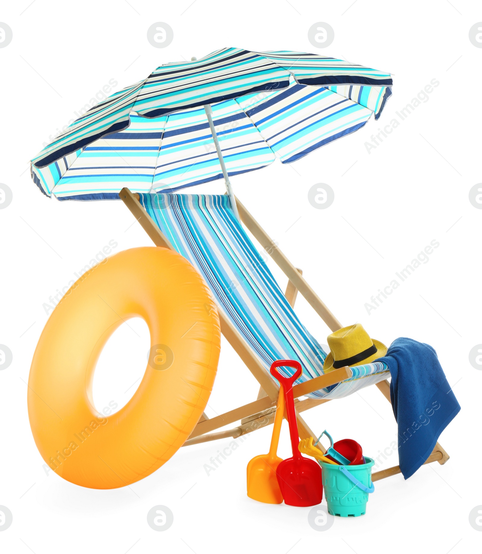 Photo of Beach umbrella, deck chair, inflatable ring, hat, towel and child's sand toys on white background