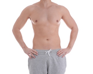 Young athletic man on white background, closeup. Weight loss