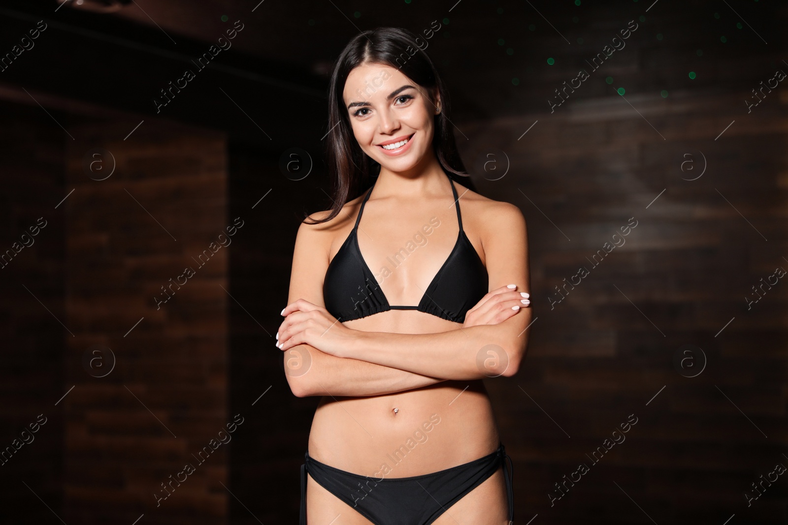 Photo of Beautiful young woman in bikini at spa center