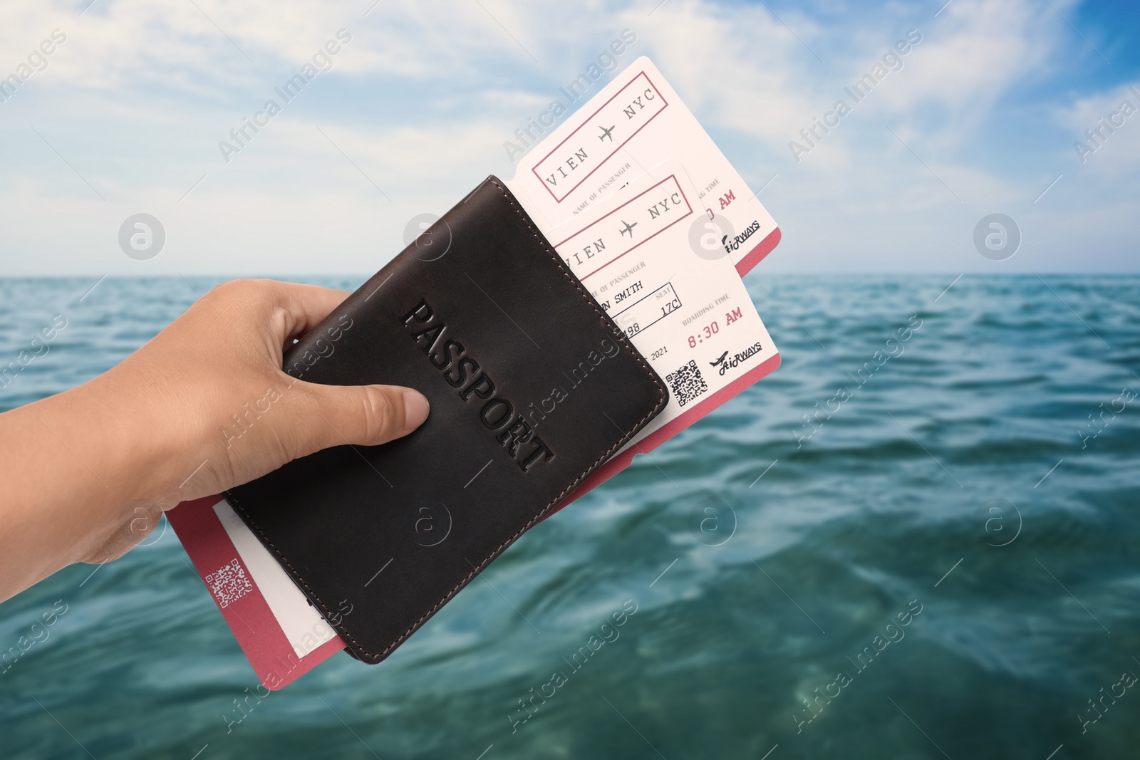 Image of Woman holding passport with tickets near sea, closeup. Travel agency service