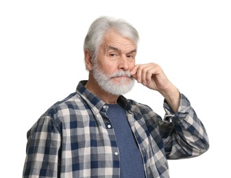 Senior man touching mustache on white background