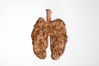 No smoking concept. Top view of dry tobacco through burned lungs shaped paper