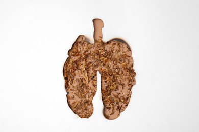 Photo of No smoking concept. Top view of dry tobacco through burned lungs shaped paper