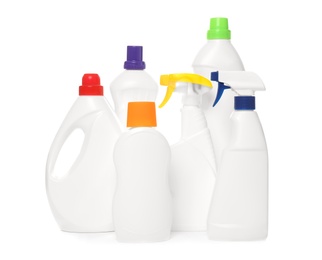 Bottles of different cleaning products on white background